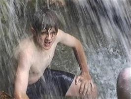Gavin getting a thorough soaking in the waterfall at Gordale Scar